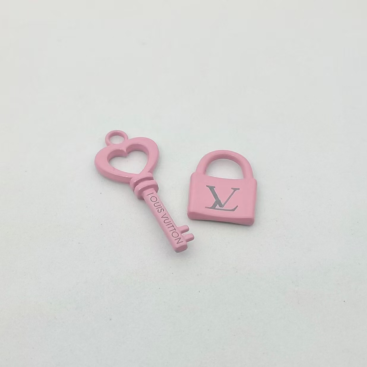 A set of pink keys and locks