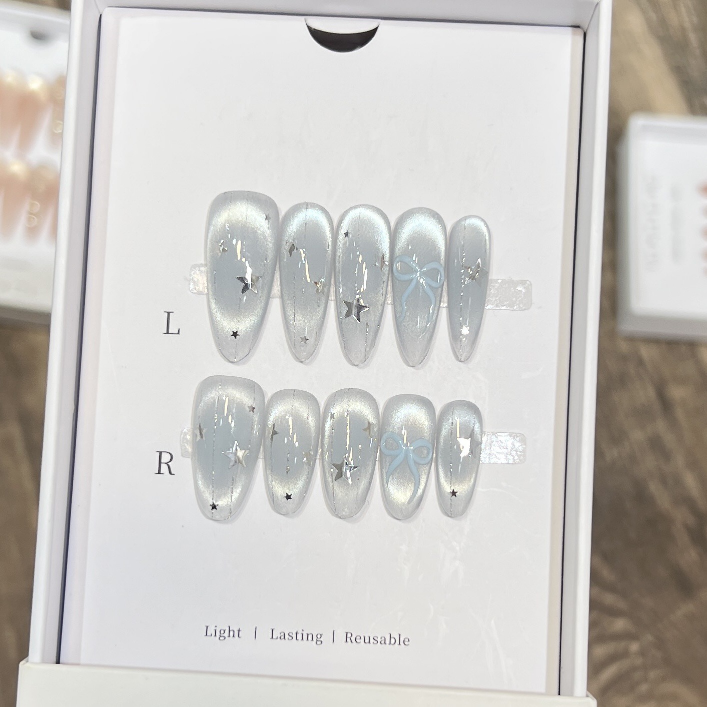 Ice blue quenched glass beads cat eye blush nail polish meteor bow